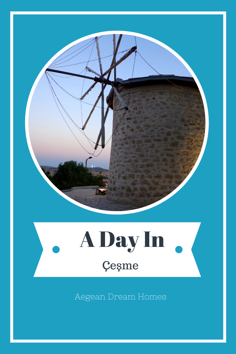 Blog banner picture of çeşme alaçatı windmills. Text overlay reads: A day out n çeşme Aegean Dream Homes