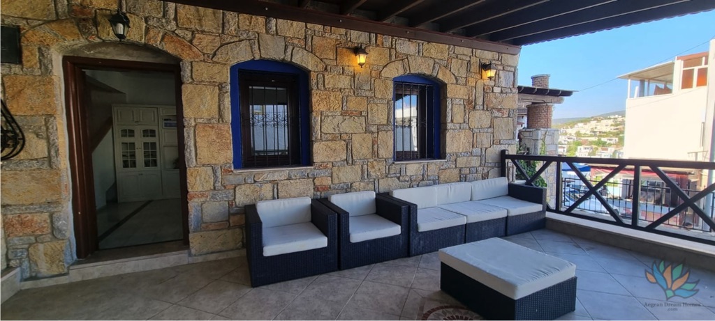 Picture of Bodrum proeprty for sale terrace with furniture looking out over Bodrum. 